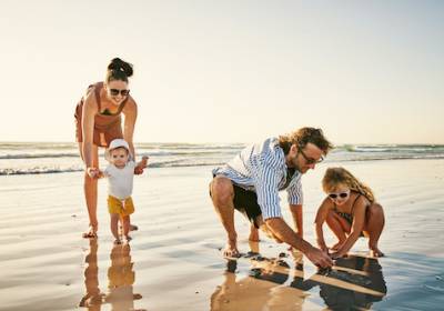A family enjoy a day on the beach